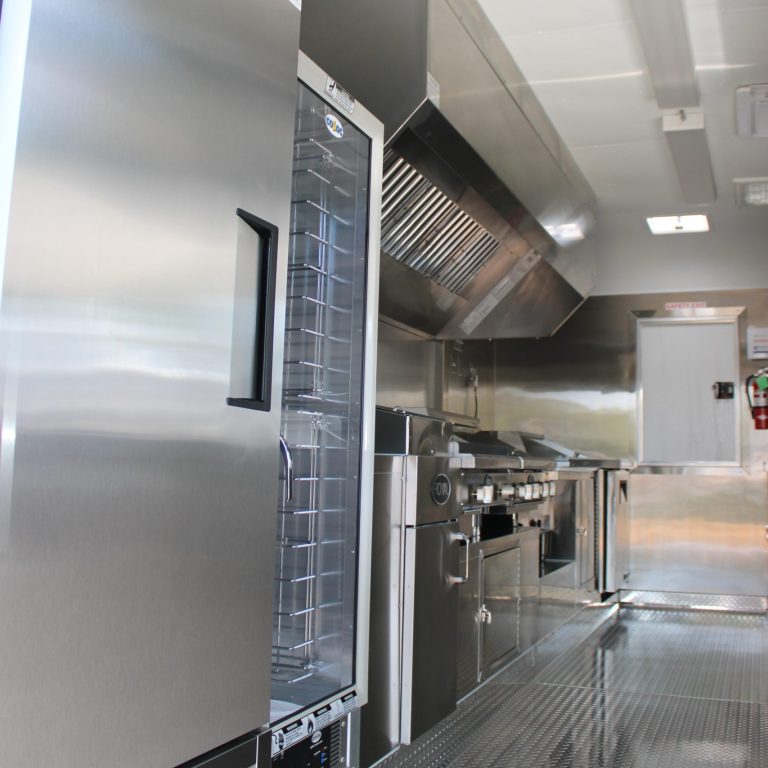 Food trailer interior commercial refrigerator and ventilation hood system - Million Dollar Spot 18ft trailer Tracy CA