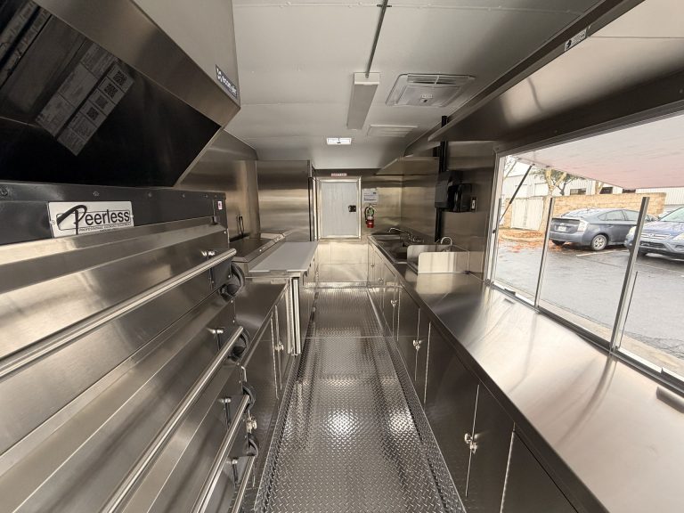 food trailer interior with optimized kitchen layout and stainless steel workspace