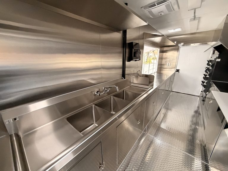 Triple compartment sink and handwash sink inside pizza food trailer in Arroyo Grande CA