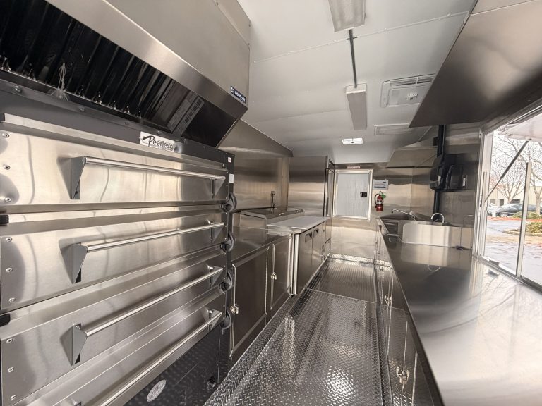 Double stack pizza ovens and prep area inside pizza food trailer
