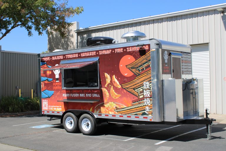 custom food trailer with vibrant full wrap branding and bold graphic design