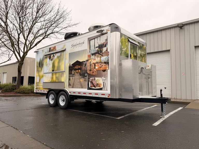 custom food trailer with clean branded wrap featuring food imagery and modern design