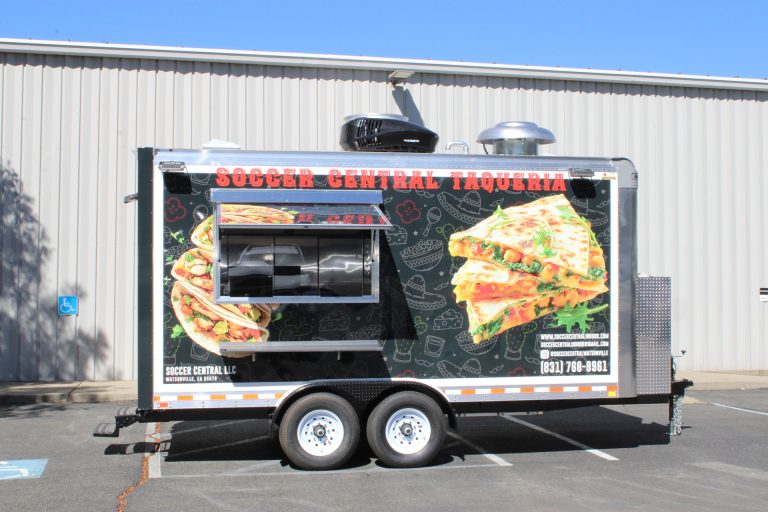 Angled side view of 16ft taco food trailer in Watsonville CA with serving window