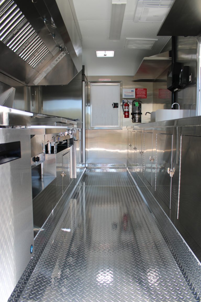 Full interior aisle of 16ft taco food trailer in Watsonville CA with cooking and prep stations