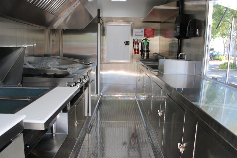 Interior kitchen aisle of 16ft taco food trailer in Watsonville CA