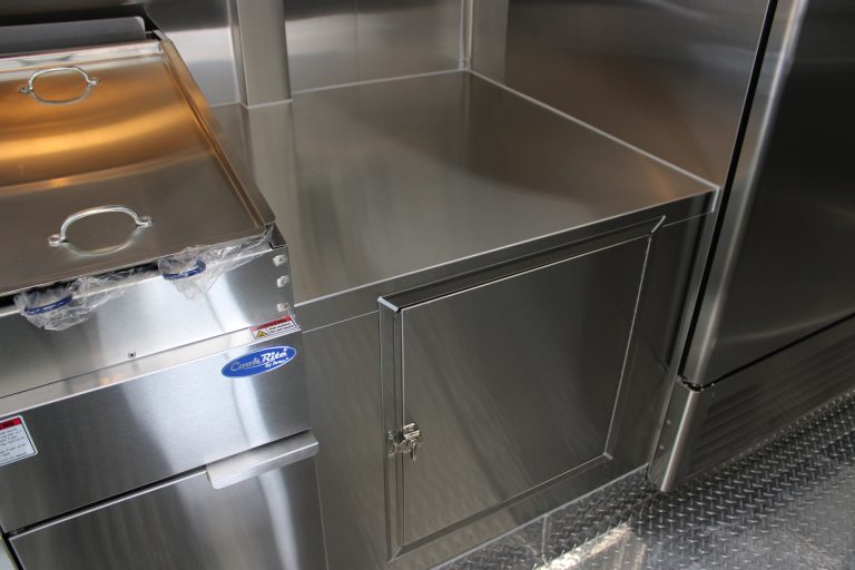 stainless steel cabinet and equipment storage in food trailer kitchen