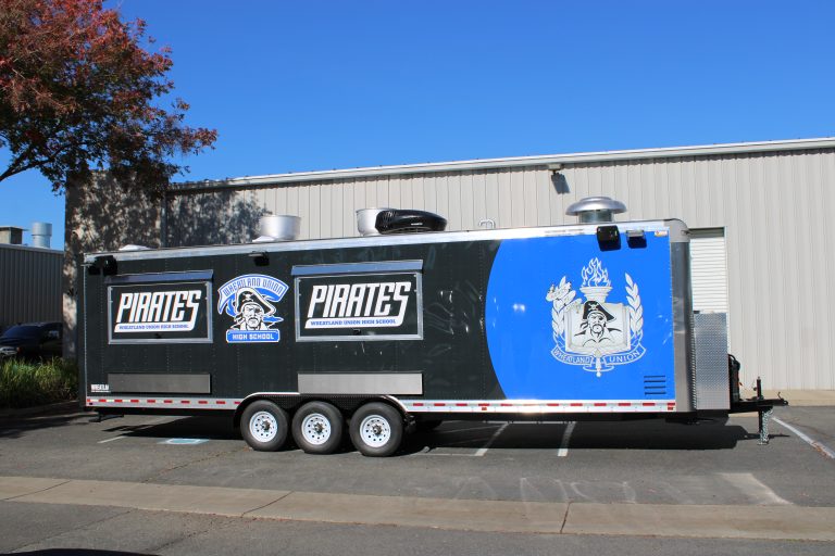 Opposite side view of 30ft school concession trailer in Wheatland CA with Pirates wrap