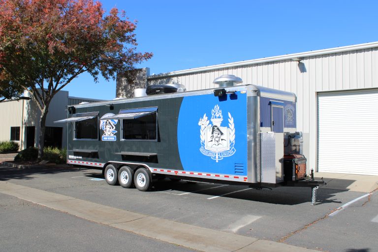 Front side view of 30ft school concession trailer in Wheatland CA with Pirates graphics