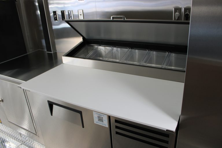 custom food trailer refrigerated prep table with ingredient pans and storage
