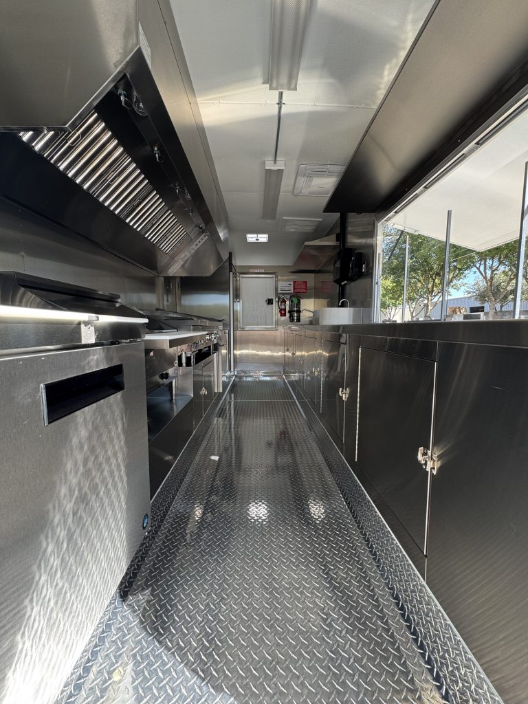 Cooking line and prep counter inside 16ft taco food trailer in Watsonville CA