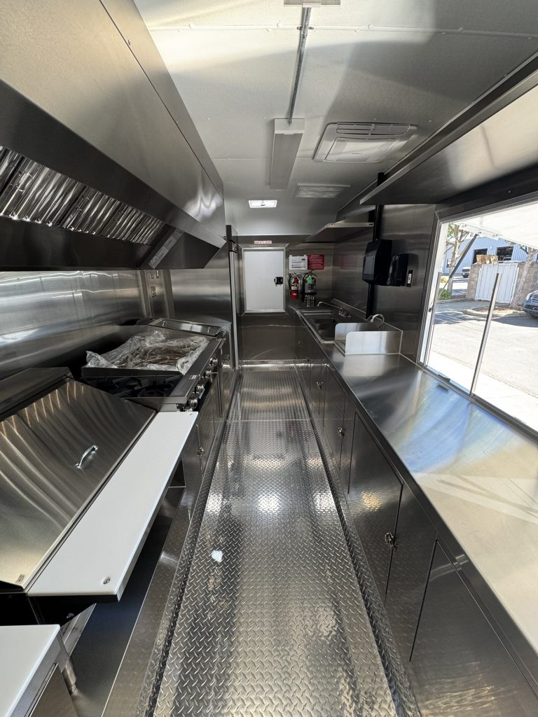 Interior service counter and cooking equipment inside 16ft taco food trailer in Watsonville CA