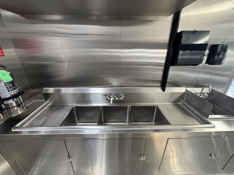 Three compartment sink inside 16ft taco food trailer in Watsonville CA