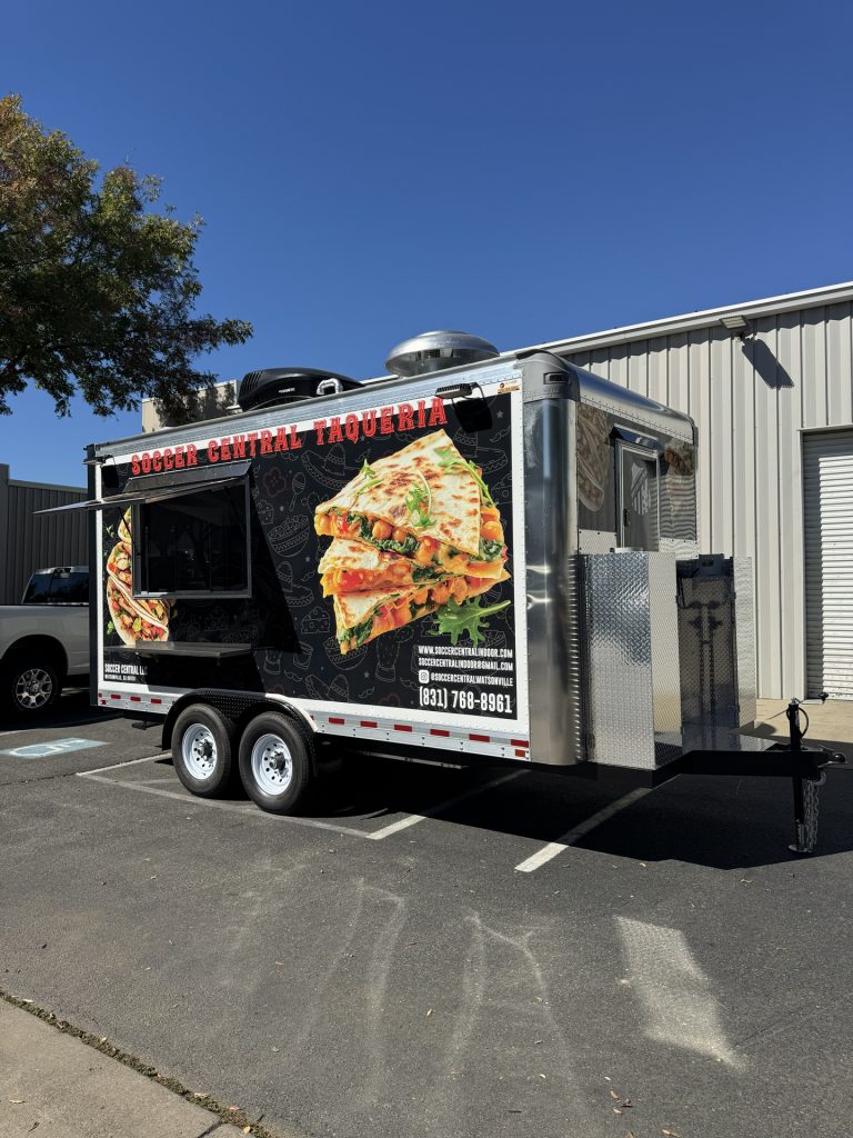 Rear corner view of 16ft taco food trailer in Watsonville CA with diamond plate trim
