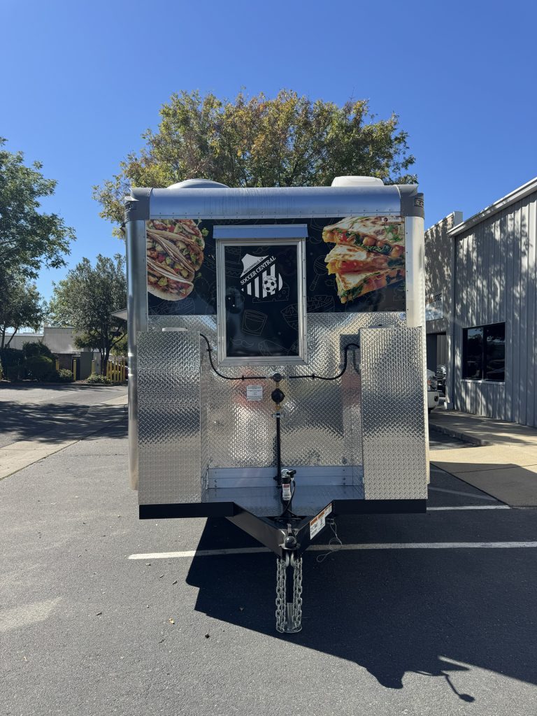 Front view of 16ft taco food trailer in Watsonville CA with diamond plate finish