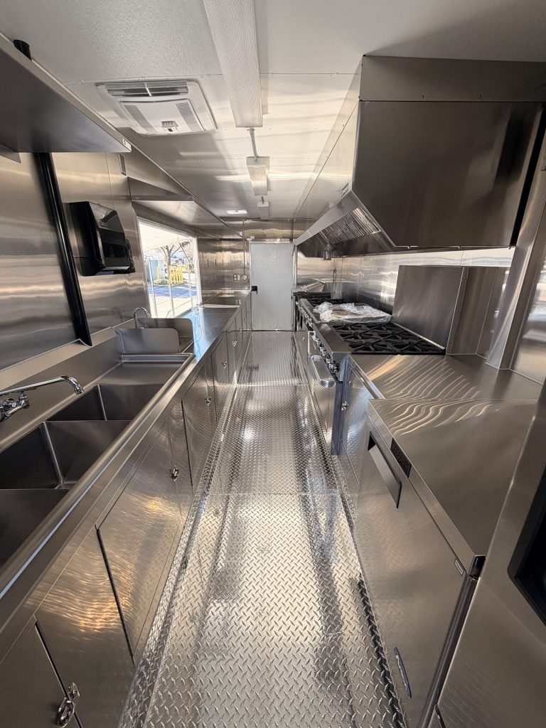 Interior of 22ft Indian food trailer in San Jose CA with stainless steel equipment
