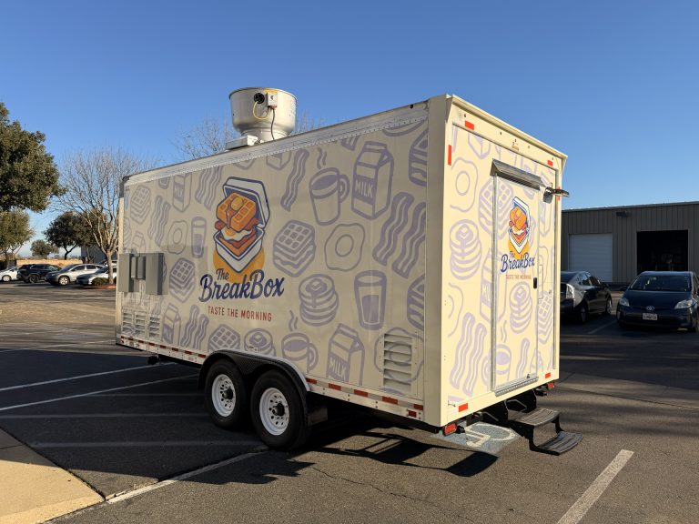 18ft breakfast food trailer rear view with rooftop AC unit entry door and full illustrated 3M wrap Golden State Trailers California