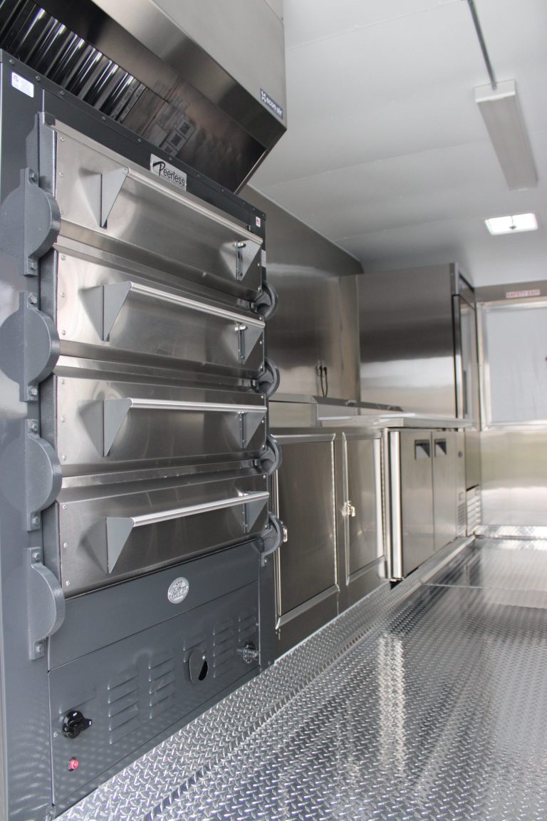 Commercial pizza oven inside pizza food trailer kitchen