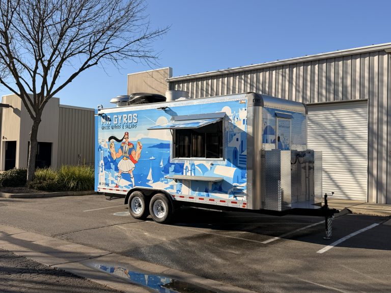 custom food trailer with full commercial wrap branding and serving window