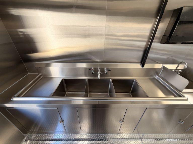 triple sink system in food trailer meeting commercial sanitation requirements