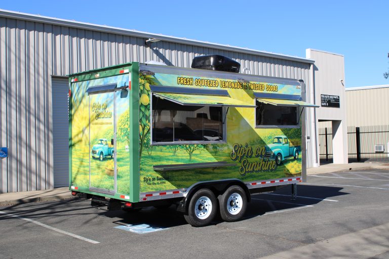 Sip'n on Sunshine custom 16ft lemonade trailer full exterior view with vibrant lemon orchard 3M wrap, dual serving windows and Dometic rooftop AC, Yuba City CA