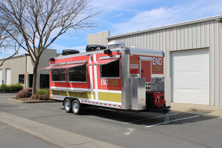 End Zone Kitchen 22ft food trailer front angle with extended awning, open serving windows, generator compartment and red gold 3M wrap, Santa Clara CA