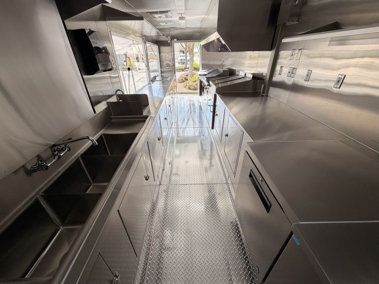 End Zone Kitchen food trailer full interior overhead view showing complete kitchen layout with sink, prep counters, cooking line and diamond plate flooring throughout