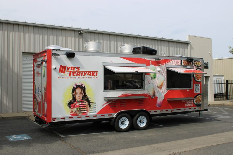 Mya's Teriyaki custom food trailer front-side angle view with open serving window and red 3M vinyl wrap, Golden State Trailers build