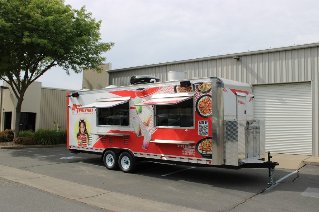 Mya's Teriyaki custom 24ft Asian cuisine food trailer with full 3M vinyl wrap, serving window and boba tea bar branding, Mitchell SD