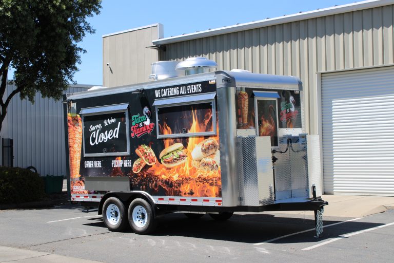 Black 16ft taco trailer with food graphics and aluminum front platform for Tacos El Flamingo