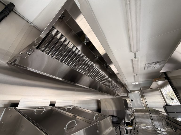 Mya's Teriyaki food trailer commercial exhaust hood with grease filters, fire suppression nozzles and concealed electrical wiring, NSF certified build