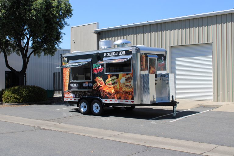 Custom 16ft Mexican food trailer with aluminum front and catering graphics for Tacos El Flamingo