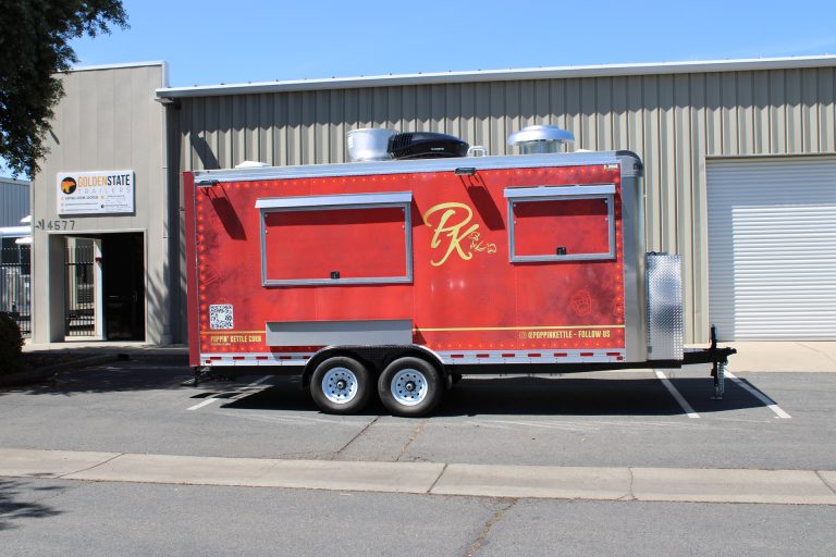 Side profile of 18ft kettle corn concession trailer with red custom wrap and tandem axle chassis