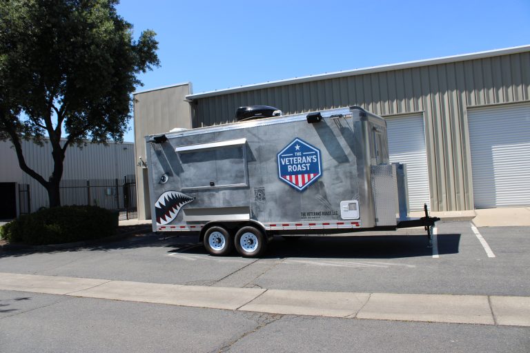 18ft American catering trailer with military-themed graphics and concession window in New Hampshire