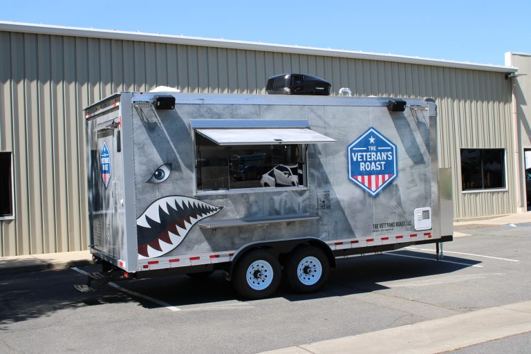 18ft American food trailer with military-themed wrap and open serving window in Nashua New Hampshire