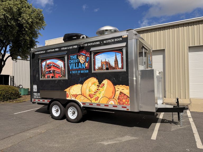 The Cheeky Villan 16ft British food trailer rear three-quarter view with black 3M wrap, British landmark graphics, pie illustrations and Dometic rooftop AC, Golden State Trailers