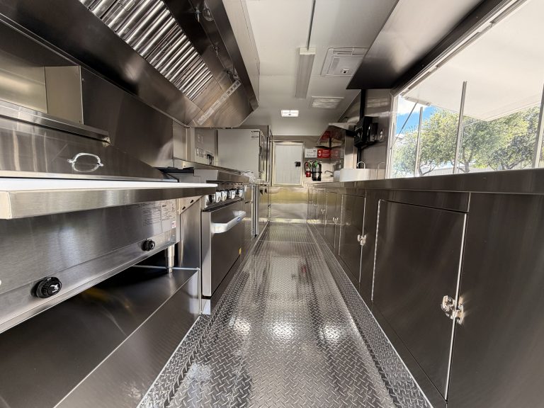 Custom food trailer interior 304 stainless steel kitchen with commercial hood and welded cabinets Golden State Trailers