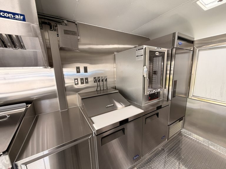 Food trailer prep area with under-counter refrigeration stainless steel sink and concealed electrical outlets Golden State Trailers