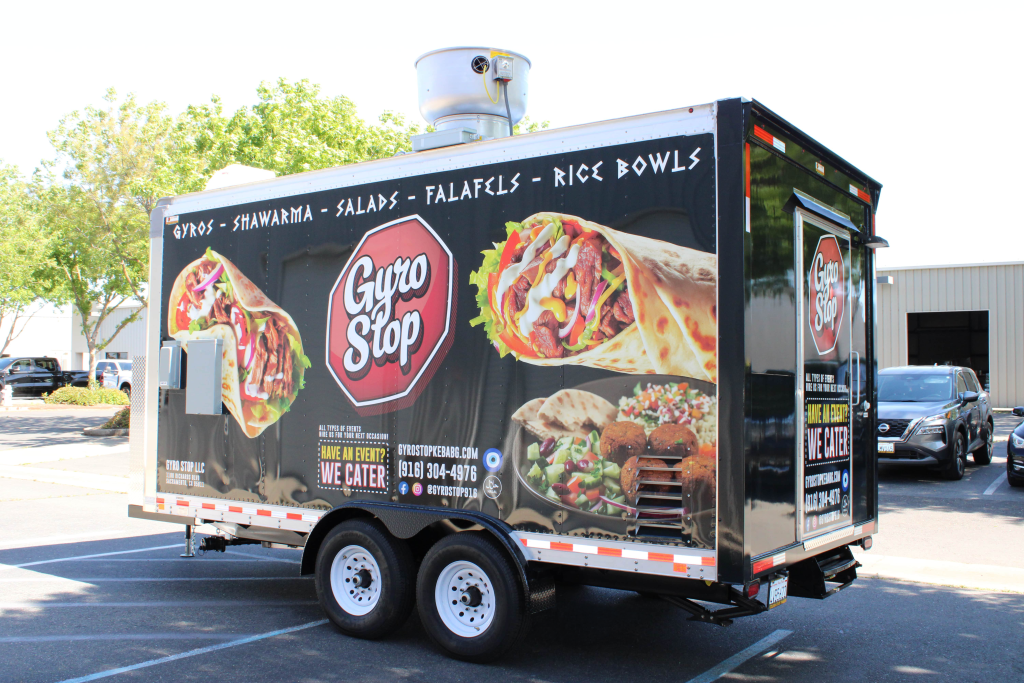 Gyro Stop food trailer wrap advertising gyros, shawarma, salads, and falafel, a Mediterranean food truck concept.