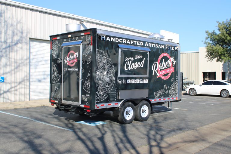 Rear corner angle of 16ft pizza food trailer with artisan pizza graphics in Hills California