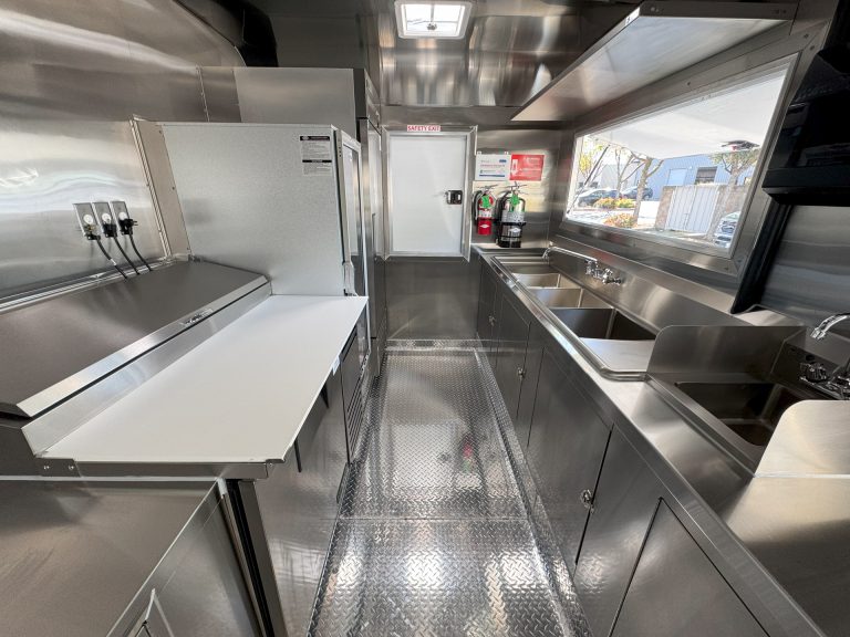 Interior prep counter and sink station inside 16ft golf course food trailer kitchen