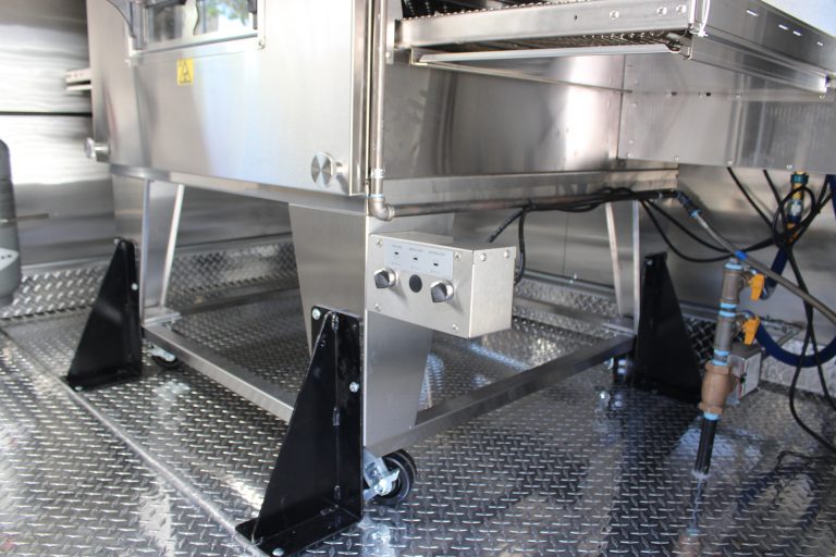 stainless steel commercial kitchen equipment inside pizza food trailer