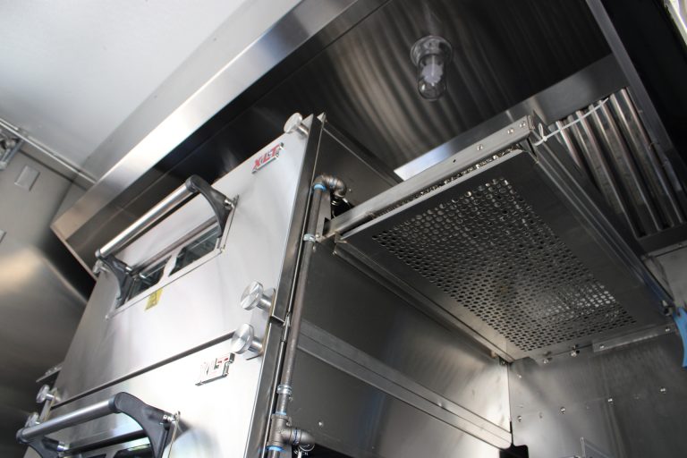 commercial ventilation hood inside custom pizza food trailer