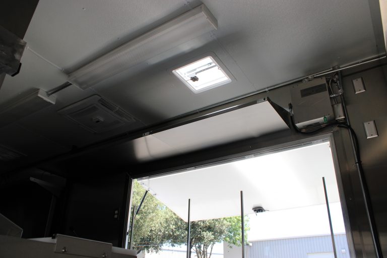 interior lighting near service window in pizza food trailer