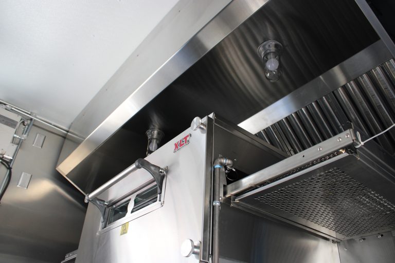 stainless steel hood over cooking line inside pizza food trailer