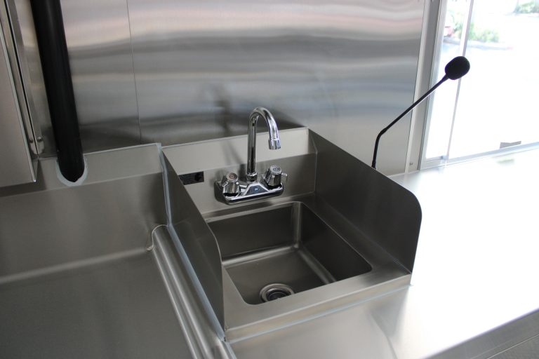 commercial handwashing sink inside custom pizza food trailer