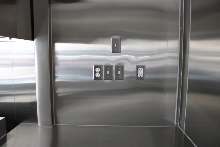 electrical outlets and controls inside pizza food trailer