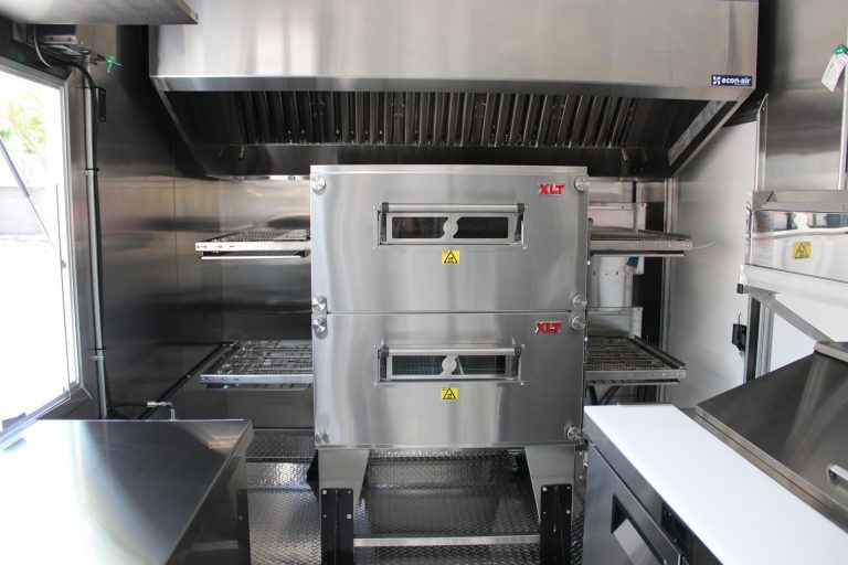 double-stack conveyor pizza oven inside commercial pizza food trailer