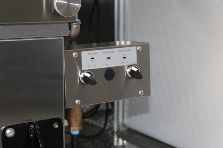 commercial cooking equipment control panel in pizza food trailer