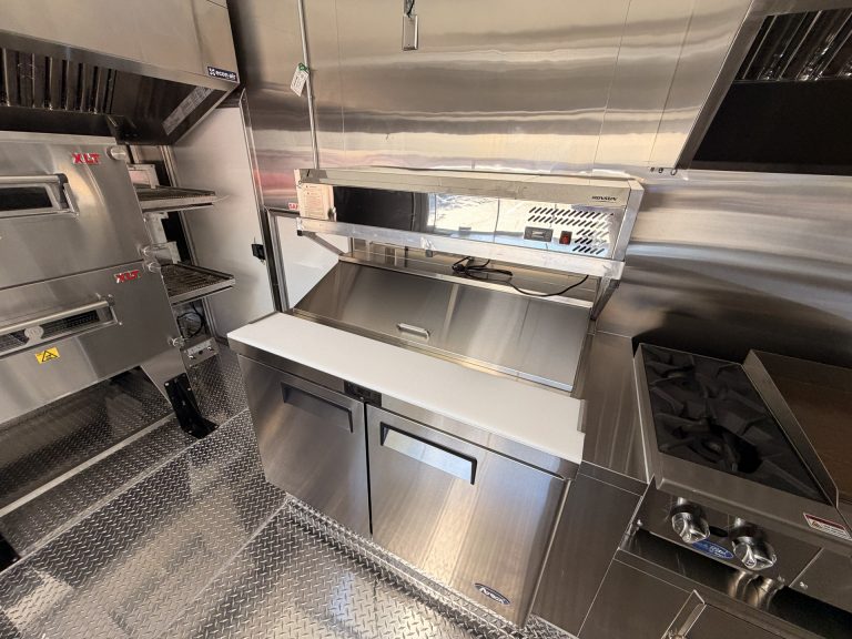 commercial cooking and prep equipment inside pizza food trailer