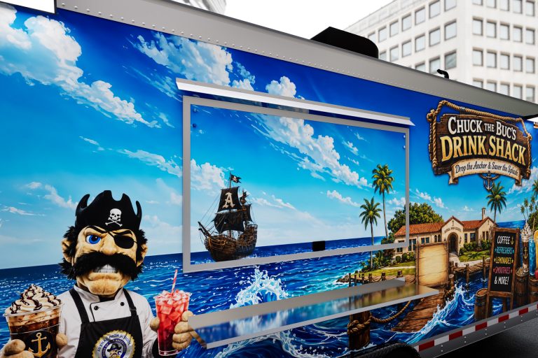 Close-up 3D view of the service window with Avenal High School nautical-themed trailer wrap